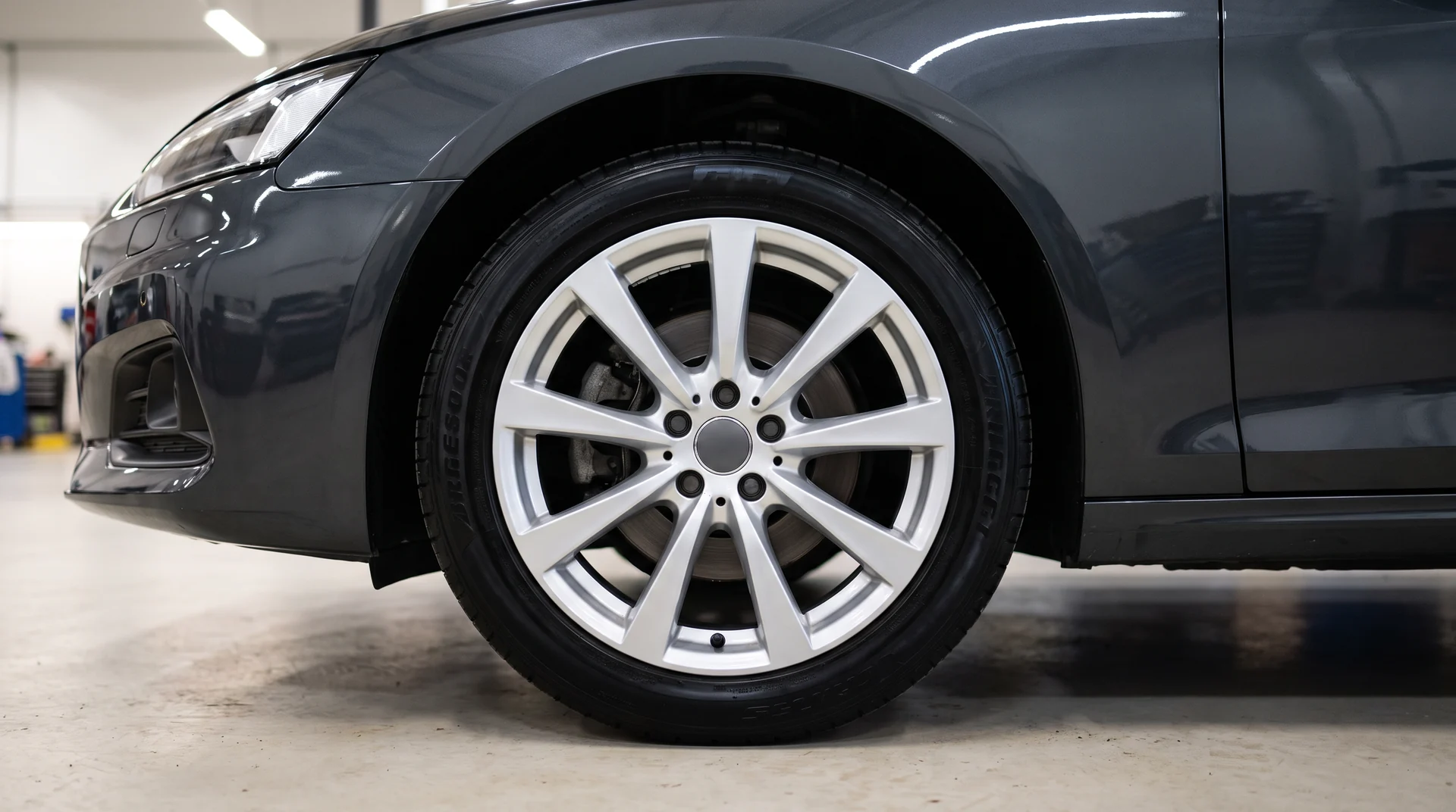 The same wheel after detailing, the spoke faces bright and the tire dressed black