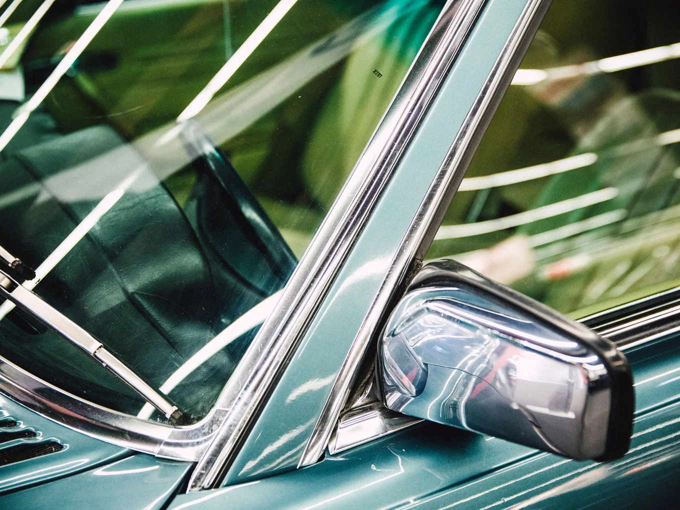 Chrome trim and glass finished on a dark vehicle