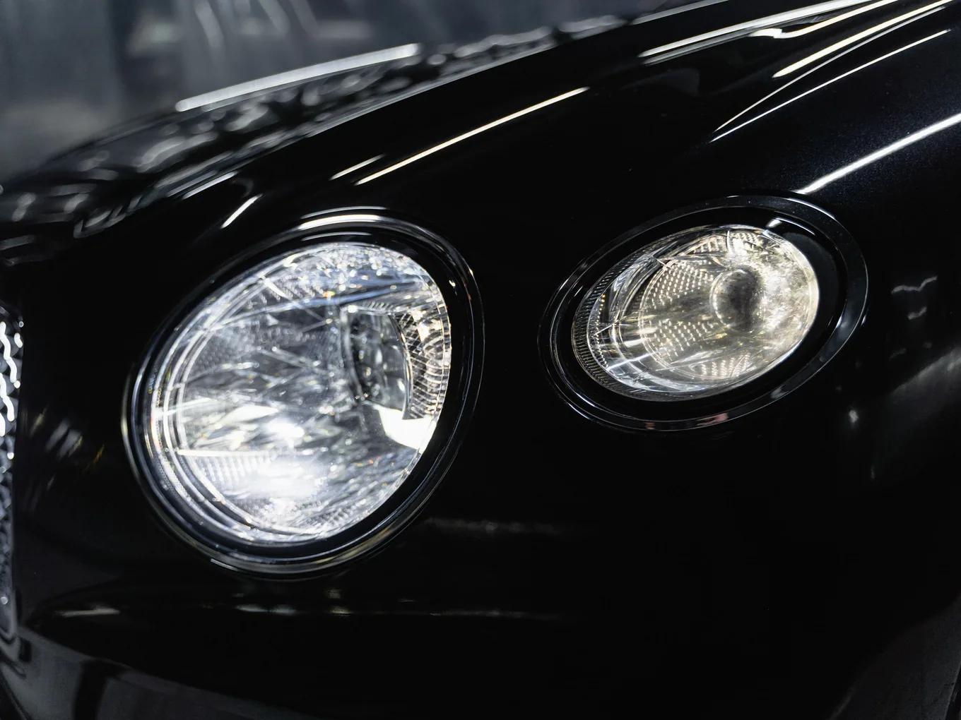 Polished black front end with the headlight glass clear and reflective